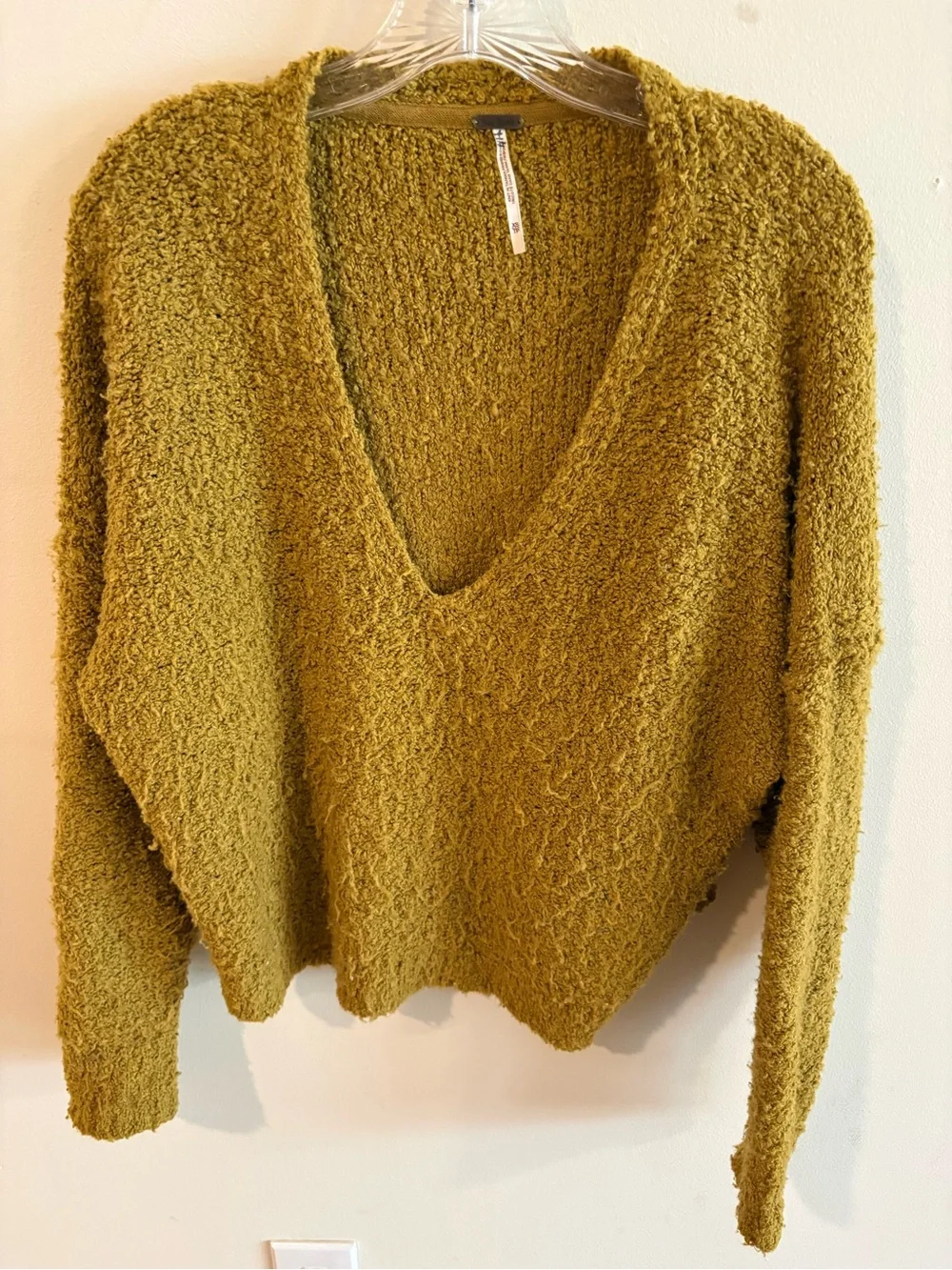 Free People Finders Keepers Bouclé V-Neck Sweater in Athena moss green